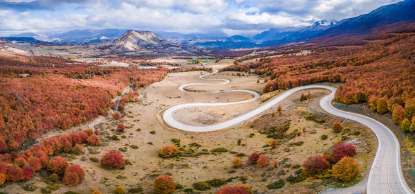 High angle view of road amidst mountains against sky