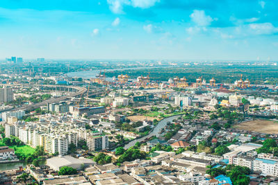 High angle view of city buildings against sky