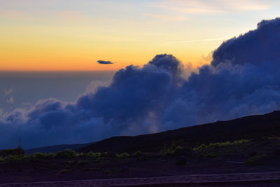 Scenic view of dramatic sky during sunset