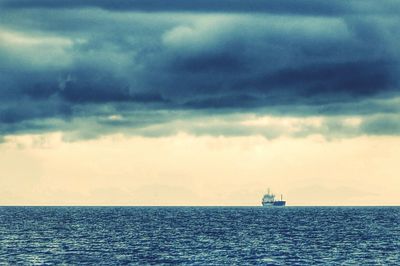 Scenic view of sea against cloudy sky