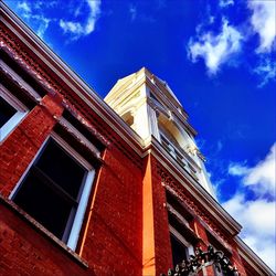 Low angle view of building against blue sky