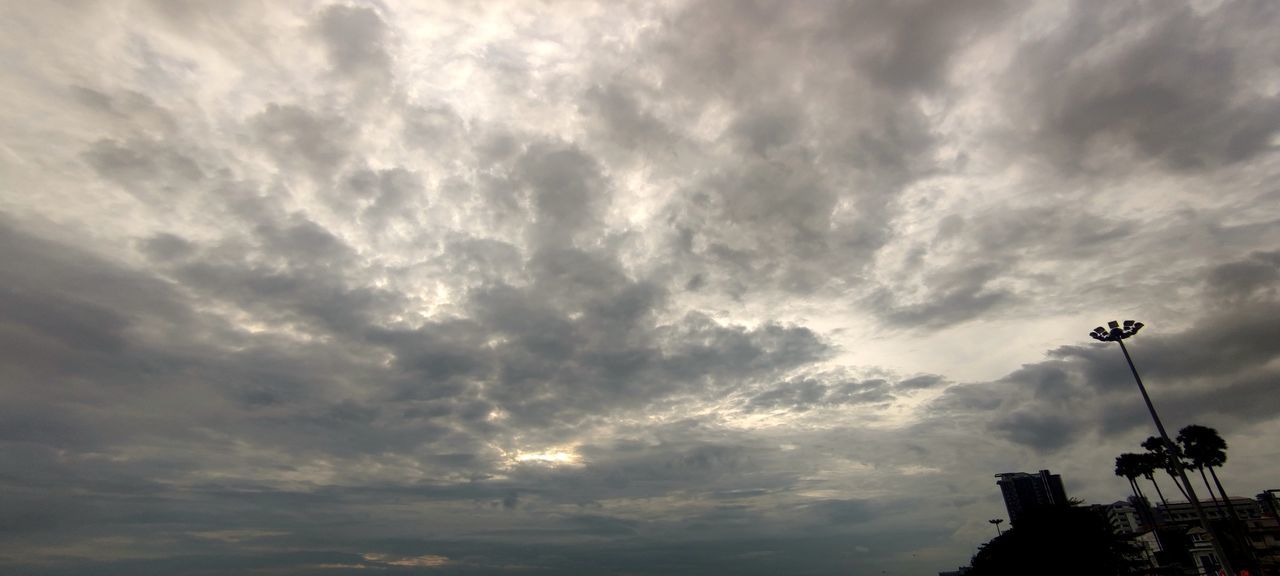 sky, cloud, horizon, morning, dusk, nature, sunlight, architecture, sun, built structure, no people, silhouette, dramatic sky, outdoors, cloudscape, low angle view, building exterior, beauty in nature, storm, scenics - nature