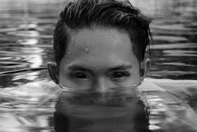 Close-up portrait of man swimming in pool