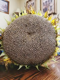 Close-up of sunflower on table at home