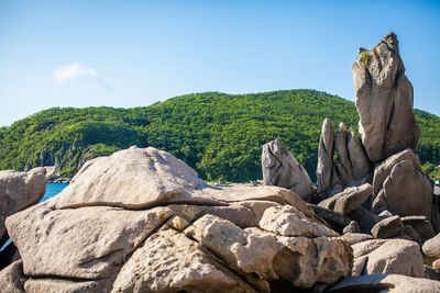 Scenic view of rocks on mountain against sky