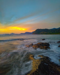 Scenic view of sea against sky during sunset