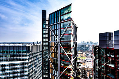 Modern buildings against sky in city