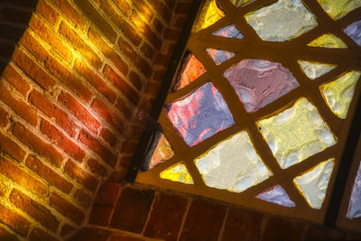 Low angle view of illuminated wall in building