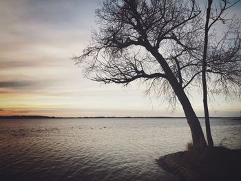 Scenic view of sea against sky at sunset