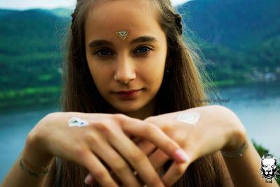 Portrait of a young woman in lake