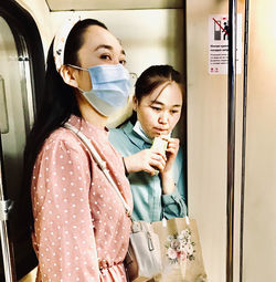 Portrait of a young woman looking down