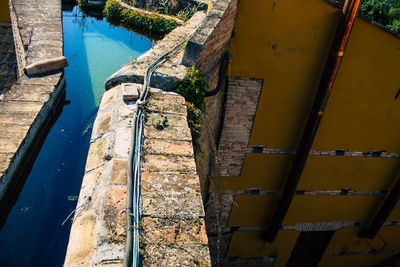 High angle view of old wall by river