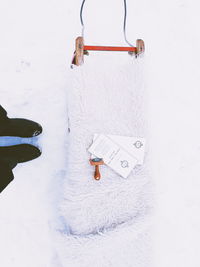 Close-up of white hanging on snow