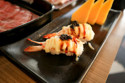 Close-up of sushi served on table