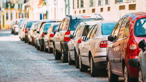 Close-up of cars on street