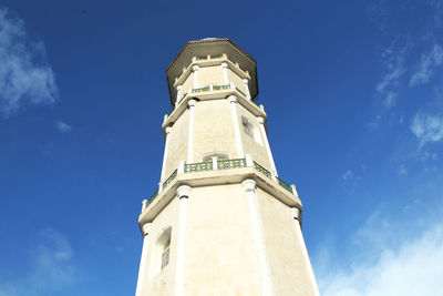 Low angle view of clock tower against sky