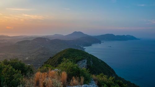 Scenic view of sea against sky at sunset