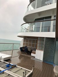 View of swimming pool by sea against sky