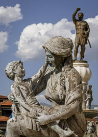 Low angle view of statue against sky