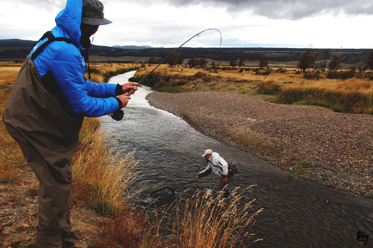 MAN FISHING ON SHORE