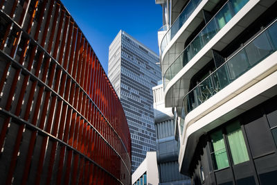 Low angle view of modern buildings against sky