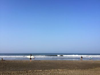 Scenic view of beach against clear sky