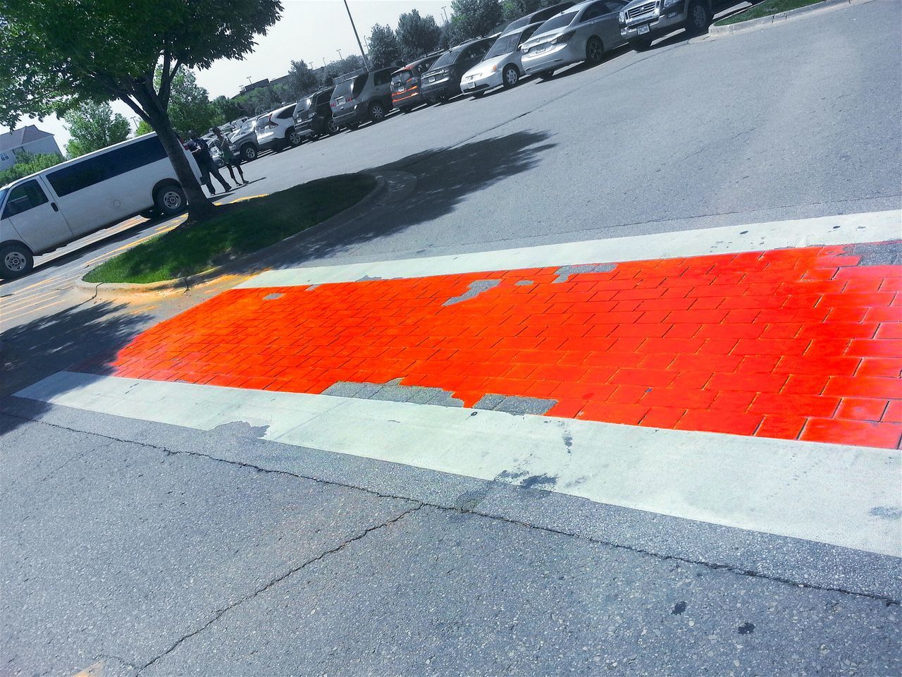 road marking, road, street, transportation, asphalt, red, car, guidance, road sign, high angle view, day, zebra crossing, sidewalk, the way forward, land vehicle, outdoors, direction, safety, mode of transport, wet