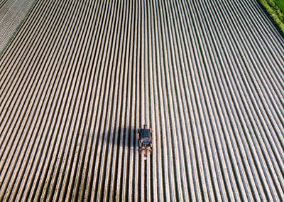 High angle view of woman standing on metal structure