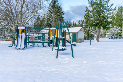 Snow covers a playground at a park in burien, washington.