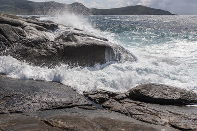 Sea waves splashing on rocks