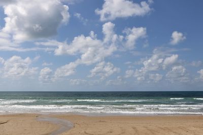 Scenic view of beach against sky