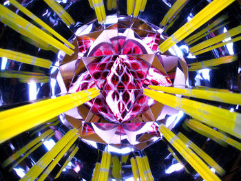 Low angle view of illuminated ferris wheel