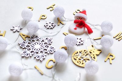 High angle view of christmas decorations on white background