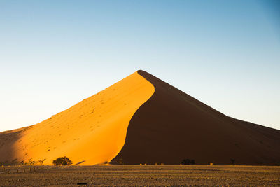 View of desert against clear sky