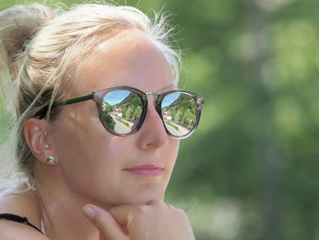 Close-up portrait of woman with sunglasses