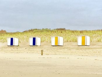 Built structure on beach against sky