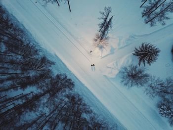 Scenic view of snow covered field against sky