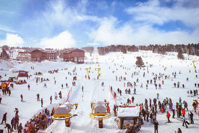 High angle view of snow covered mountain against sky