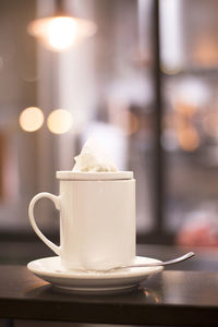 Close-up of coffee cup on table