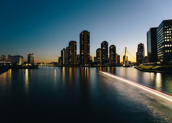 Illuminated city at waterfront