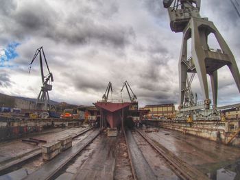 Pier at harbor against sky