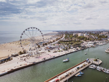 High angle view of ferris wheel in city