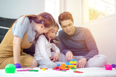 Mother and son playing with toy