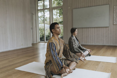 Man and woman meditating