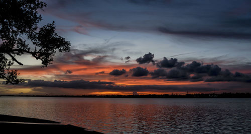 Scenic view of sea against orange sky