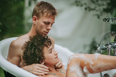 Father and son baby in water