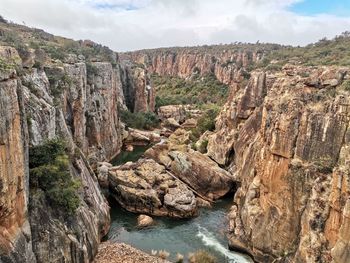 Scenic view of rock formations against sky