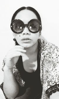 Portrait of young woman wearing sunglasses