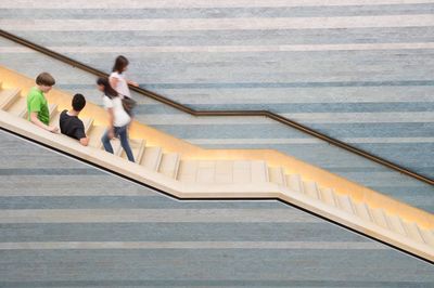 High angle view of people standing on stairs