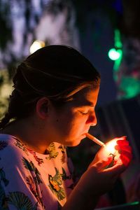 Close-up of woman smoking cigarette